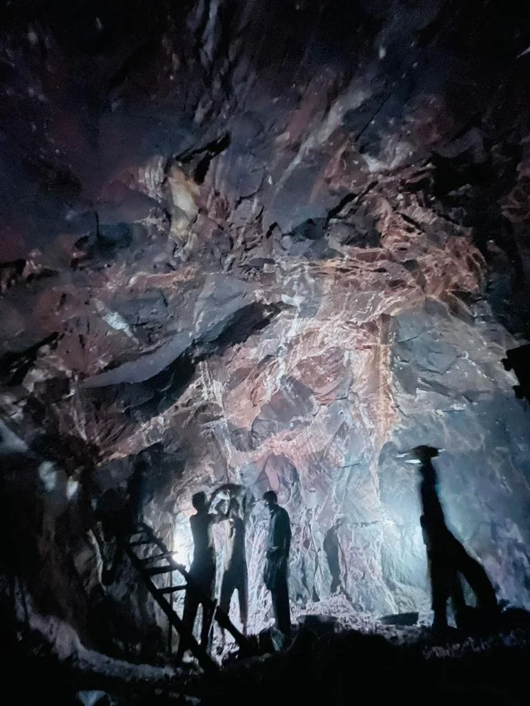 Underground salt mine interior with illuminated rock faces
